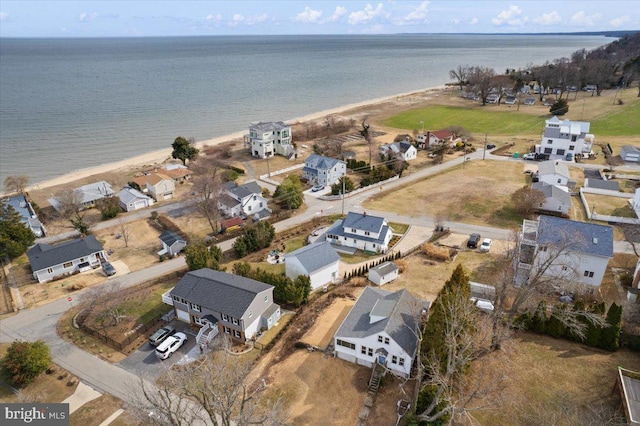 drone / aerial view with a water view and a residential view