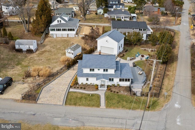 birds eye view of property with a residential view