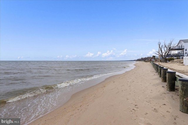 property view of water featuring a beach view