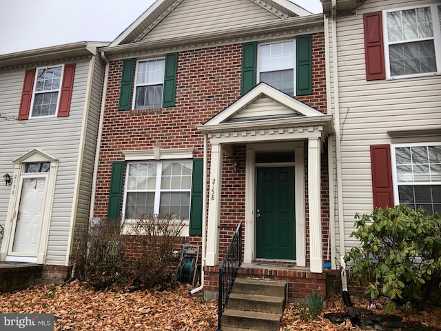 view of property with brick siding