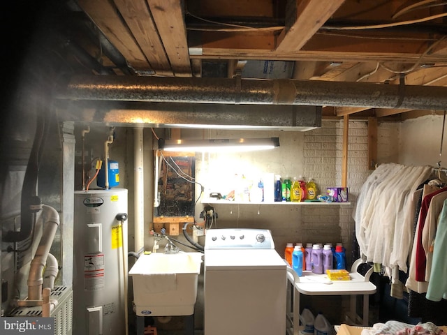 interior space with washer / dryer, water heater, and a sink