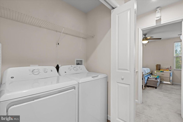 washroom featuring a ceiling fan, carpet, baseboards, laundry area, and washer and clothes dryer