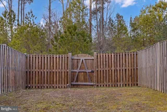 view of yard with a gate and fence private yard