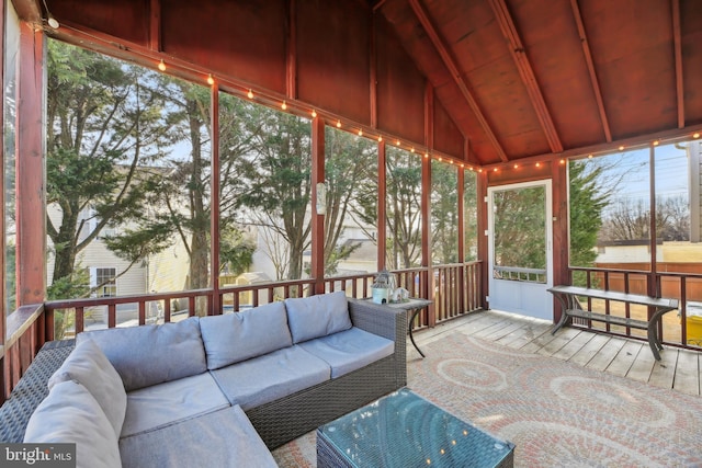 sunroom / solarium featuring wooden ceiling and vaulted ceiling with beams