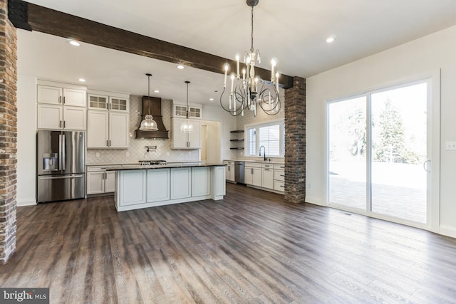 kitchen featuring dark wood-style floors, beam ceiling, decorative backsplash, appliances with stainless steel finishes, and premium range hood