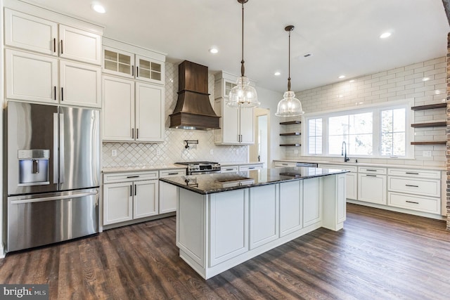 kitchen featuring open shelves, premium range hood, stainless steel appliances, and dark wood finished floors