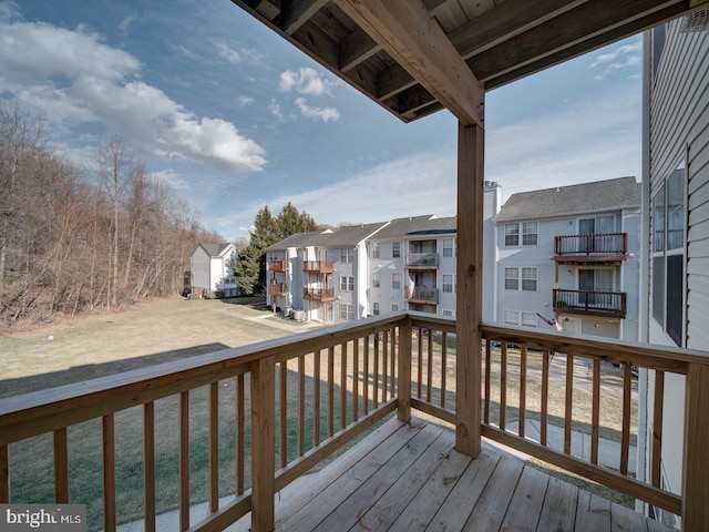 wooden deck featuring a residential view