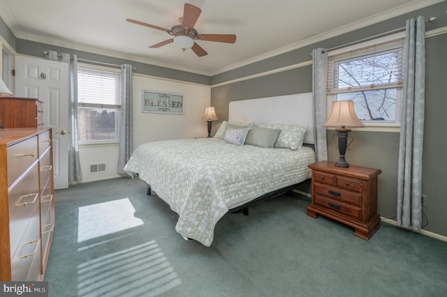 bedroom featuring carpet, visible vents, ceiling fan, and ornamental molding