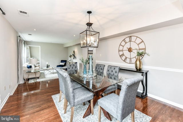 dining space with recessed lighting, visible vents, baseboards, and wood finished floors