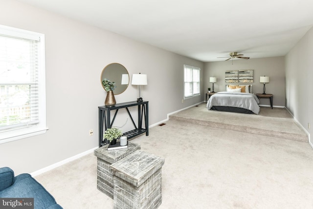 bedroom featuring ceiling fan, carpet flooring, and baseboards