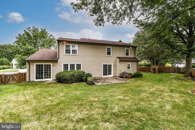 rear view of property with a fenced backyard, a patio, a chimney, and a lawn