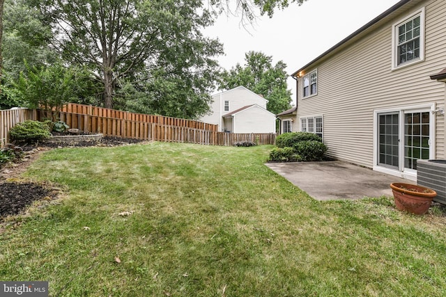 view of yard featuring central AC unit, a patio area, and fence private yard