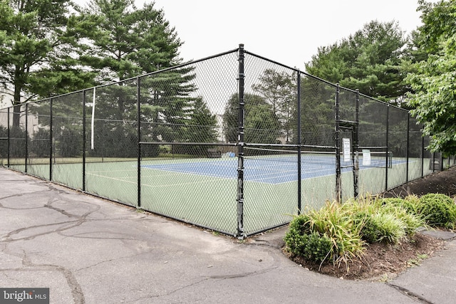 view of sport court with fence