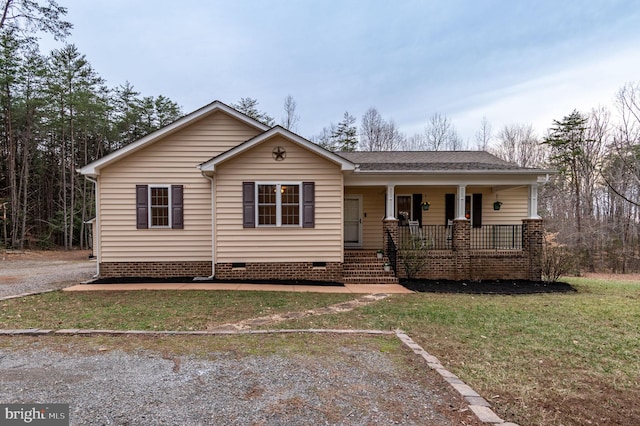 single story home with crawl space, covered porch, a front lawn, and roof with shingles