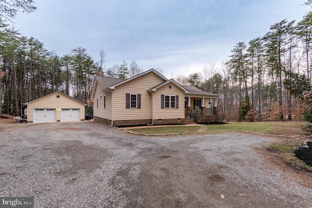 single story home with an outbuilding, covered porch, a shingled roof, a detached garage, and crawl space