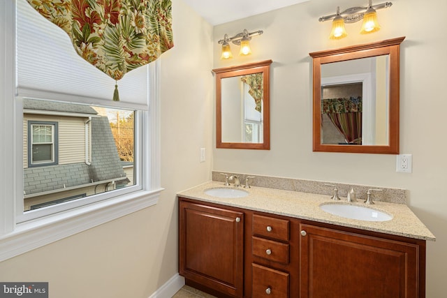 bathroom with double vanity and a sink