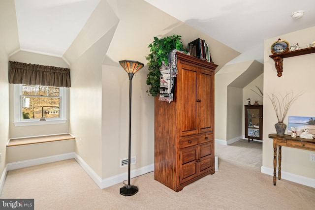 interior space featuring carpet flooring, visible vents, and baseboards