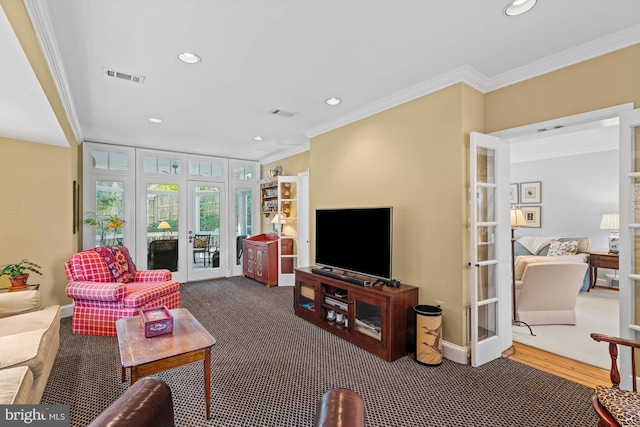 carpeted living room with recessed lighting, french doors, visible vents, and crown molding