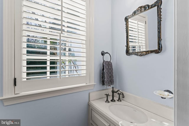 bathroom with plenty of natural light and vanity