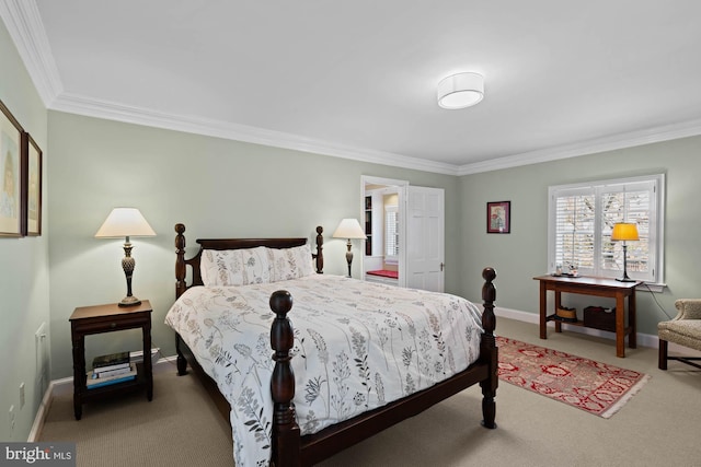 bedroom featuring crown molding, carpet flooring, and baseboards