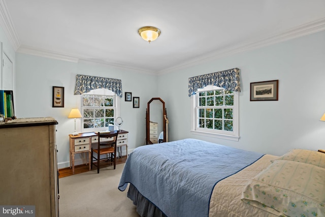 bedroom with light carpet, crown molding, and baseboards