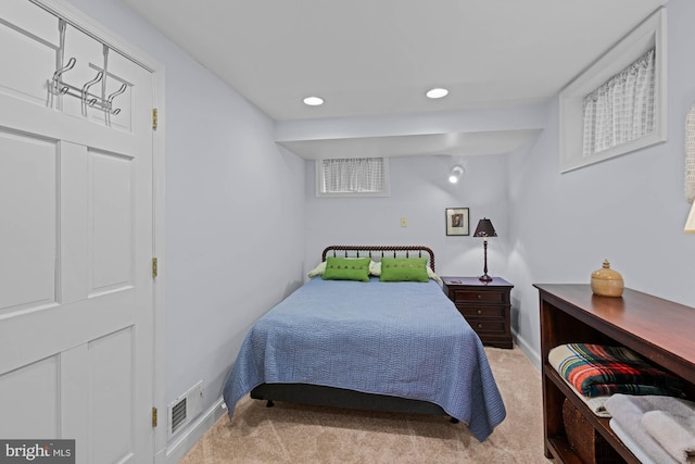 bedroom with recessed lighting, visible vents, baseboards, and light colored carpet