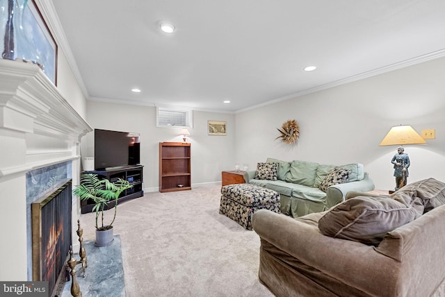 carpeted living area featuring a premium fireplace, baseboards, crown molding, and recessed lighting