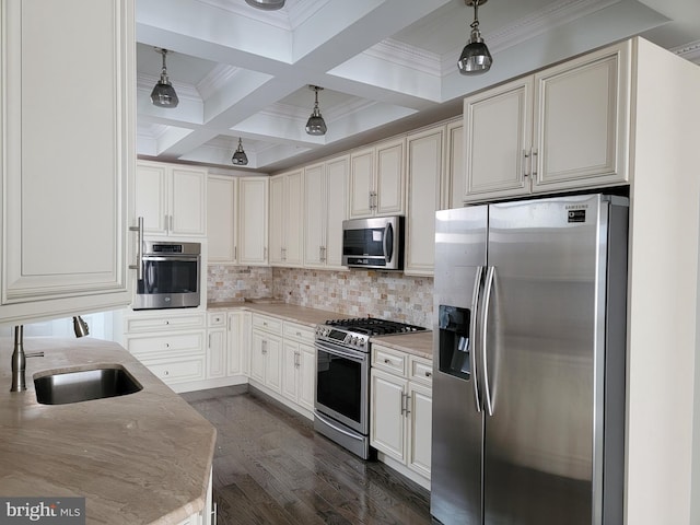 kitchen featuring stainless steel appliances, dark wood-style flooring, coffered ceiling, a sink, and beam ceiling