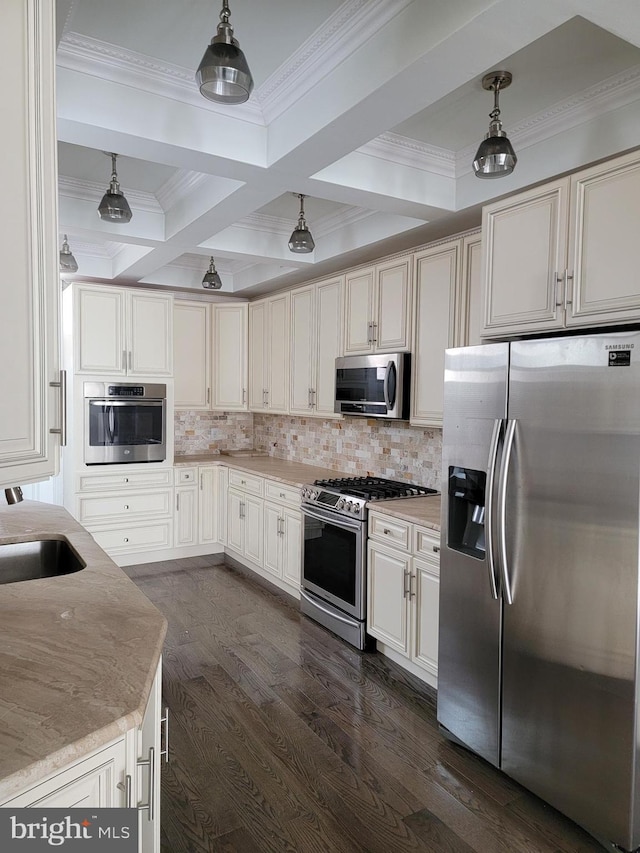 kitchen with dark wood-style floors, backsplash, decorative light fixtures, stainless steel appliances, and a sink