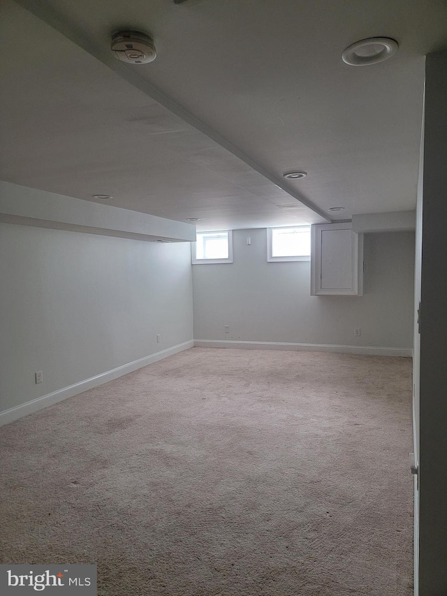 basement featuring carpet and baseboards