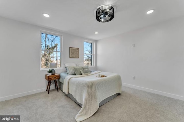 carpeted bedroom with baseboards and recessed lighting