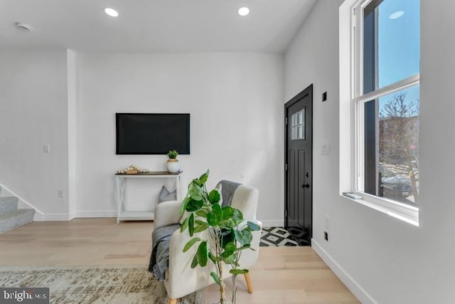 interior space with recessed lighting, stairway, baseboards, and wood finished floors