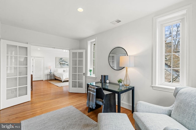 office area featuring recessed lighting, visible vents, wood finished floors, and french doors