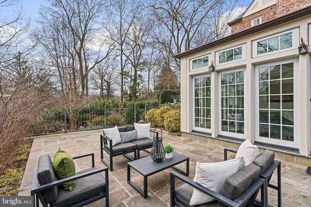 view of patio featuring fence and outdoor lounge area