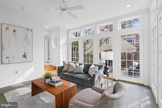 living area featuring ornamental molding, recessed lighting, ceiling fan, and baseboards