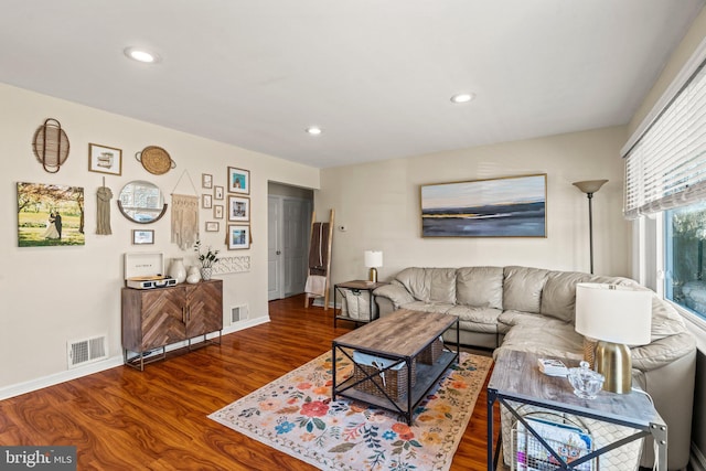 living area featuring recessed lighting, wood finished floors, and visible vents