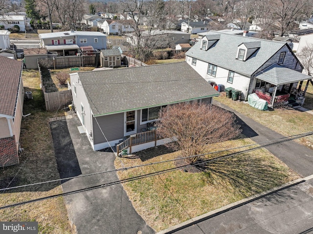 birds eye view of property with a residential view