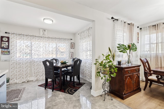 dining space featuring baseboards