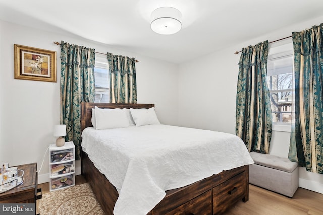 bedroom with wood finished floors