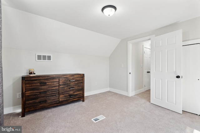 bonus room with carpet, visible vents, vaulted ceiling, and baseboards