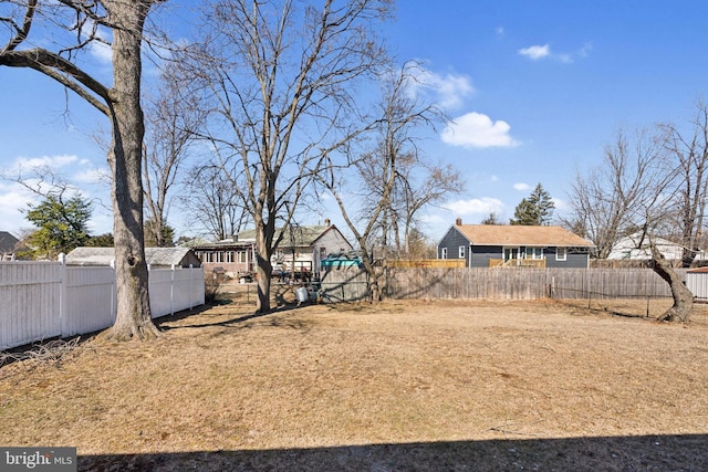 view of yard with a fenced backyard