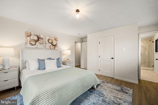 bedroom featuring baseboards and wood finished floors