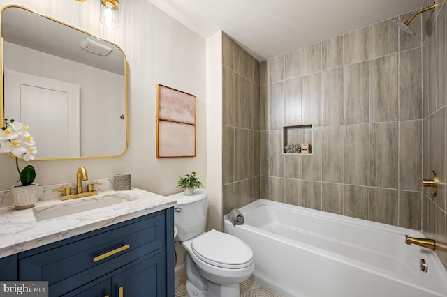 bathroom with toilet, vanity, visible vents, and bathing tub / shower combination