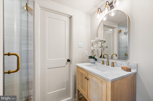 bathroom with an enclosed shower and vanity