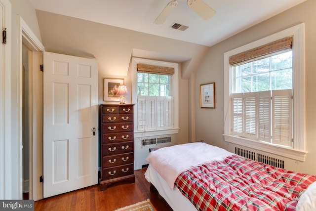 1911 Belle Haven Rd, Alexandria, VA 22307 - bedroom featuring radiator heating unit, dark wood-style floors, vaulted ceiling, and ceiling fan