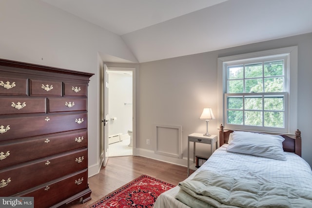 1911 Belle Haven Rd, Alexandria, VA 22307 - bedroom featuring wood finished floors, baseboards, a baseboard heating unit, and lofted ceiling