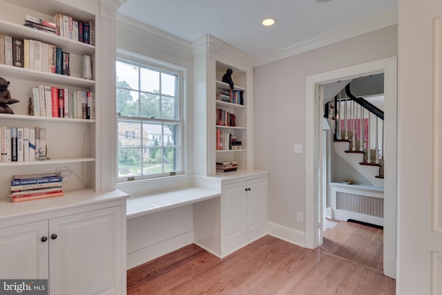 1911 Belle Haven Rd, Alexandria, VA 22307 - unfurnished room with ornamental molding, radiator heating unit, healthy amount of natural light, light wood-type flooring, and stairs