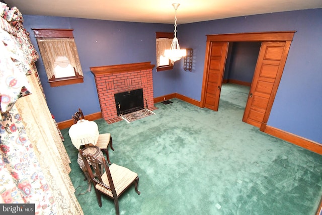 living room with baseboards, a brick fireplace, and carpet flooring