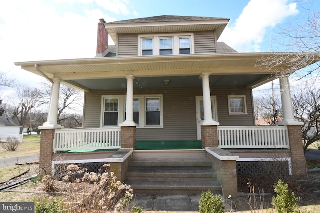 620 S Main Rd, Vineland, NJ 08360 - back of property featuring a porch, roof with shingles, and a chimney