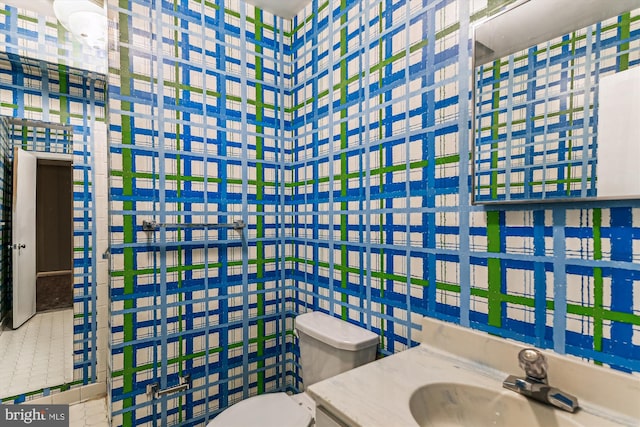 bathroom featuring vanity and toilet